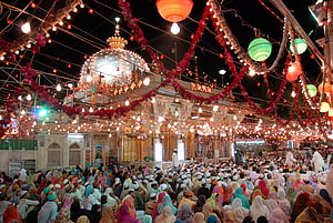 Ajmer Sharif Dargah at Night with Crowds and Festive Lanterns HD wallpaper