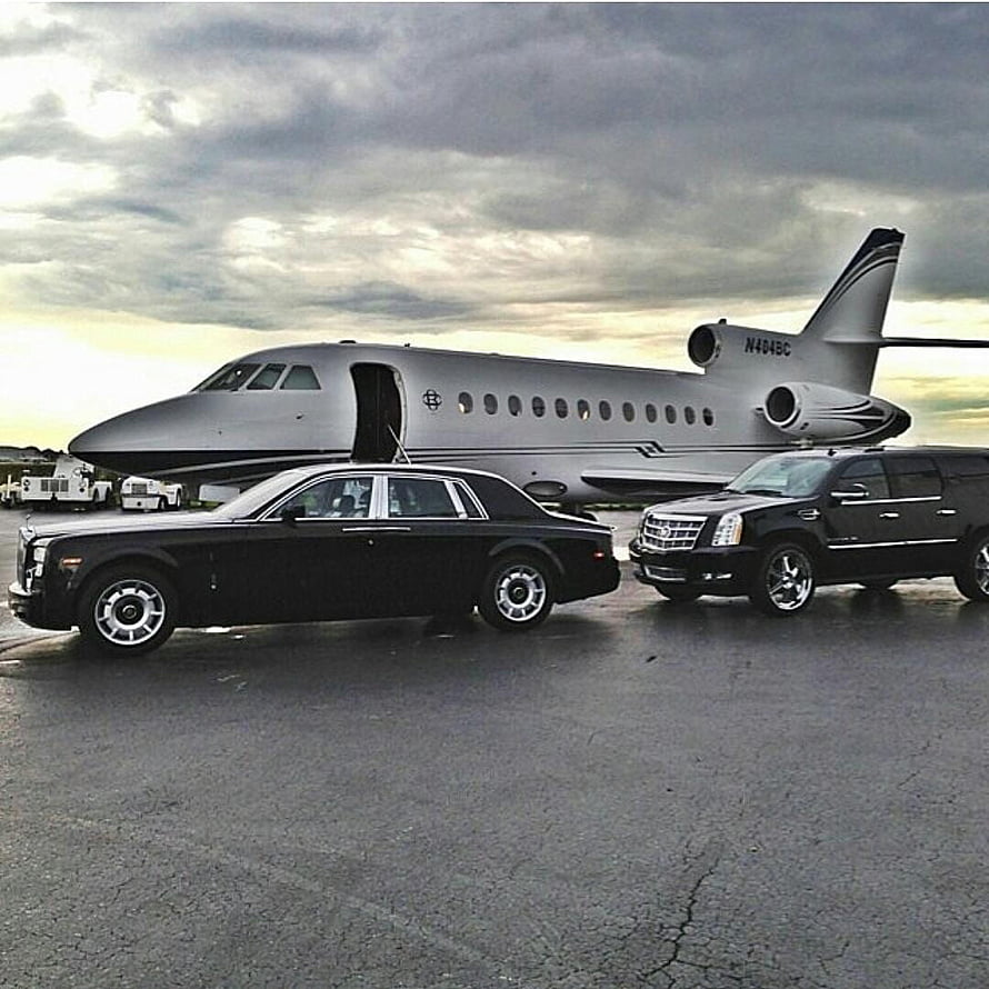 Black Rolls-Royce and Cadillac SUV Parked in Front of Private Jet on Tarmac HD phone wallpaper