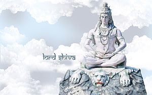 Serene Lord Shiva Statue Meditating on a Rock with a White Tiger in Clouds HD wallpaper