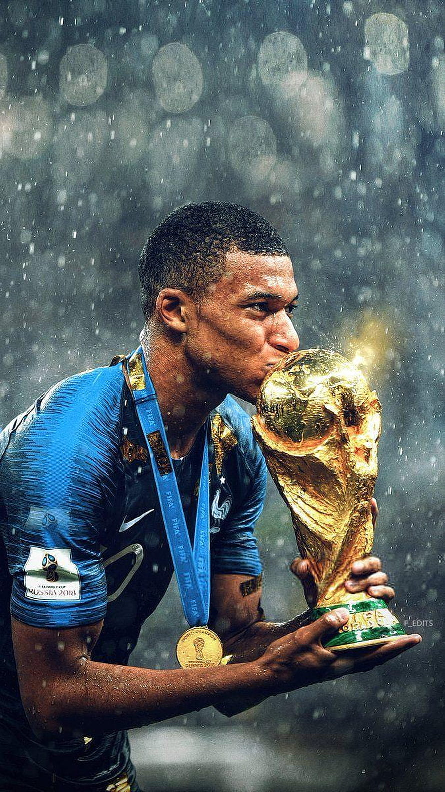 Kylian Mbappe Kissing the FIFA World Cup Trophy in Rain HD phone wallpaper