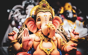 Ornate Ganesha Idol with Golden Crown and Jewelry HD wallpaper