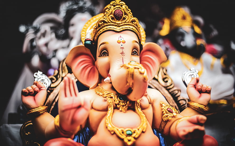 Ornate Ganesha Idol with Golden Crown and Jewelry HD wallpaper