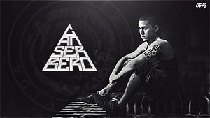 Canserbero Monochrome Portrait with Geometric Logo and Dark Industrial Background HD wallpaper
