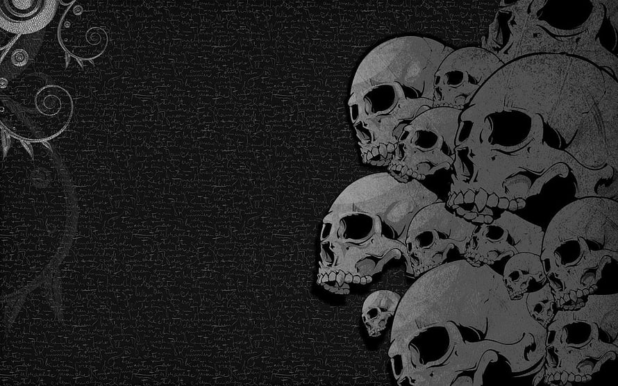 Dark Gothic Skull Cluster with Ornamental Flourishes on Textured Black Background HD wallpaper