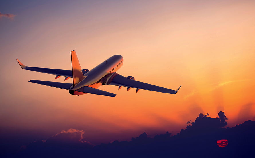 Commercial Airplane Flying Over Clouds During Golden Sunset Sky HD wallpaper