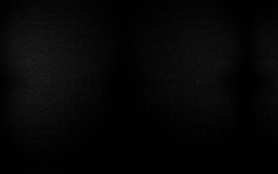 Minimalist Dark Fabric Texture with Subtle Vignette and Deep Black Tones HD wallpaper