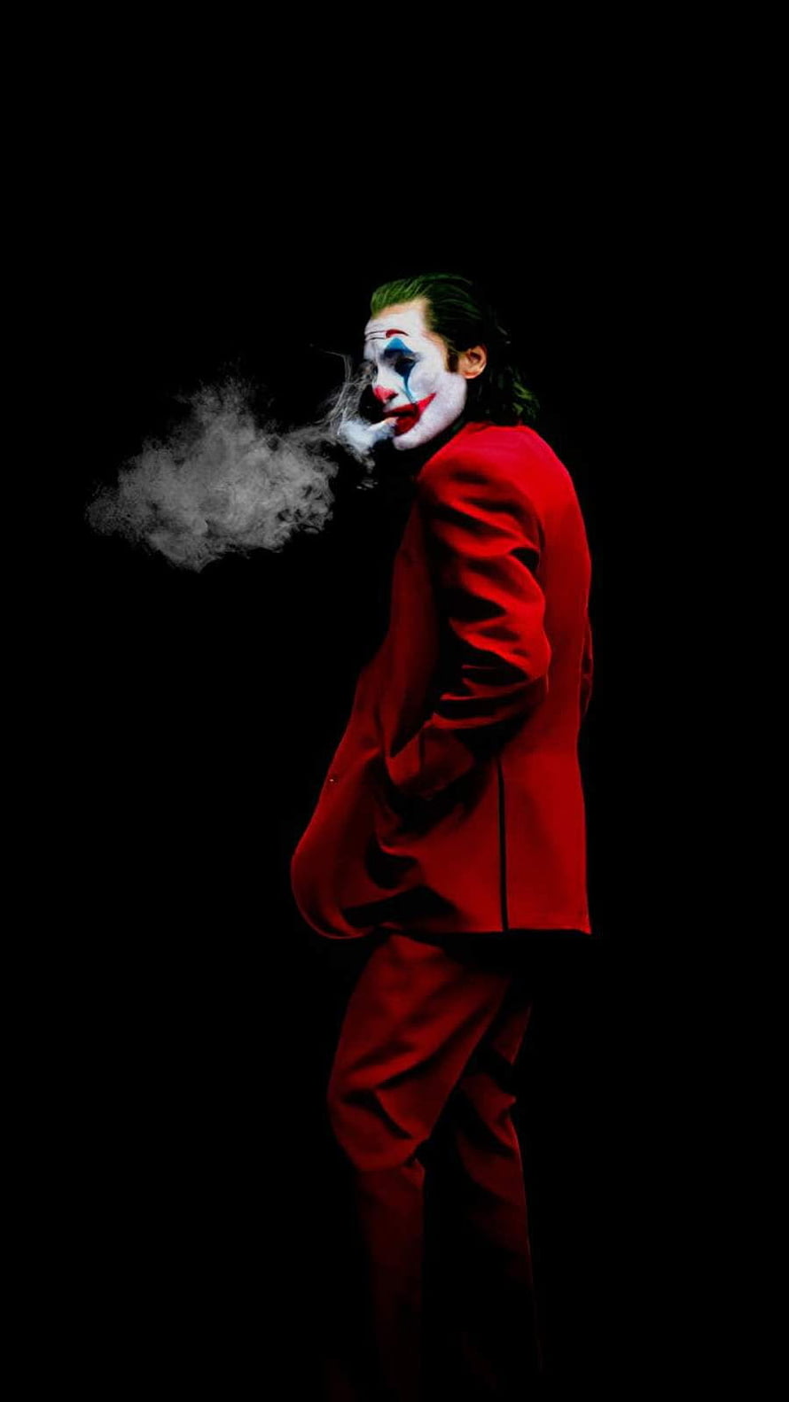 Joker in Red Suit Smoking Against Black Background HD phone wallpaper