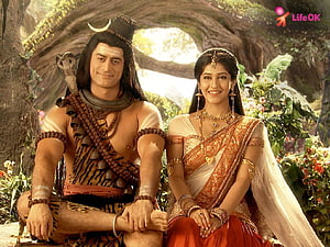 Shiv and Parvati in a lush forest setting from the Indian mythological series HD wallpaper