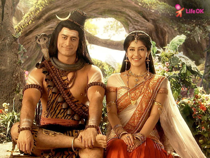 Shiv and Parvati in a lush forest setting from the Indian mythological series HD wallpaper