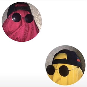 Two people wearing sunglasses and baseball caps with their faces covered by red and yellow fabric HD phone wallpaper