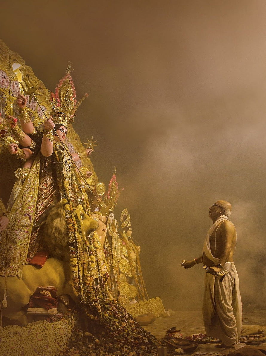 Maa Kali Temple Ritual With Priest Offering Flowers In Golden Mist HD phone wallpaper
