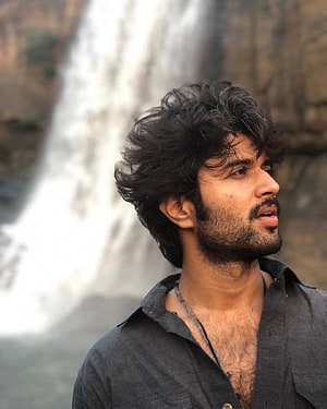 Vijay Devarakonda Profile Portrait Against Waterfall Background HD phone wallpaper