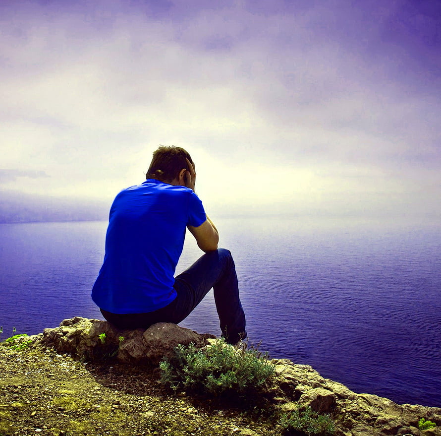 Man in blue shirt sitting alone on a rocky cliff overlooking the ocean, Top 125 Feeling Alone Boy Whatsapp dp Pics, feeling boy HD wallpaper