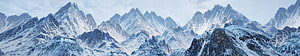 Majestic Snow-Covered Mountain Range Panorama with Jagged Peaks and Icy Valleys HD wallpaper