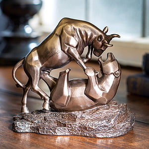 Bronze Bull and Bear Sculpture Symbolizing Market Trends and Financial Power HD wallpaper