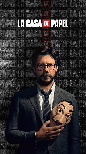 The Professor from Money Healer holding a Salvador Dali mask in a grey suit against a dark background HD phone wallpaper