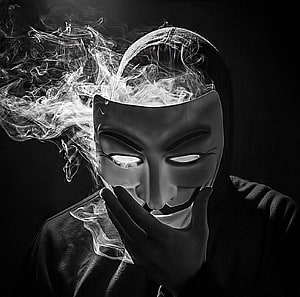 Anonymous Guy Fawkes Mask With Glowing Eyes And Smoke HD wallpaper