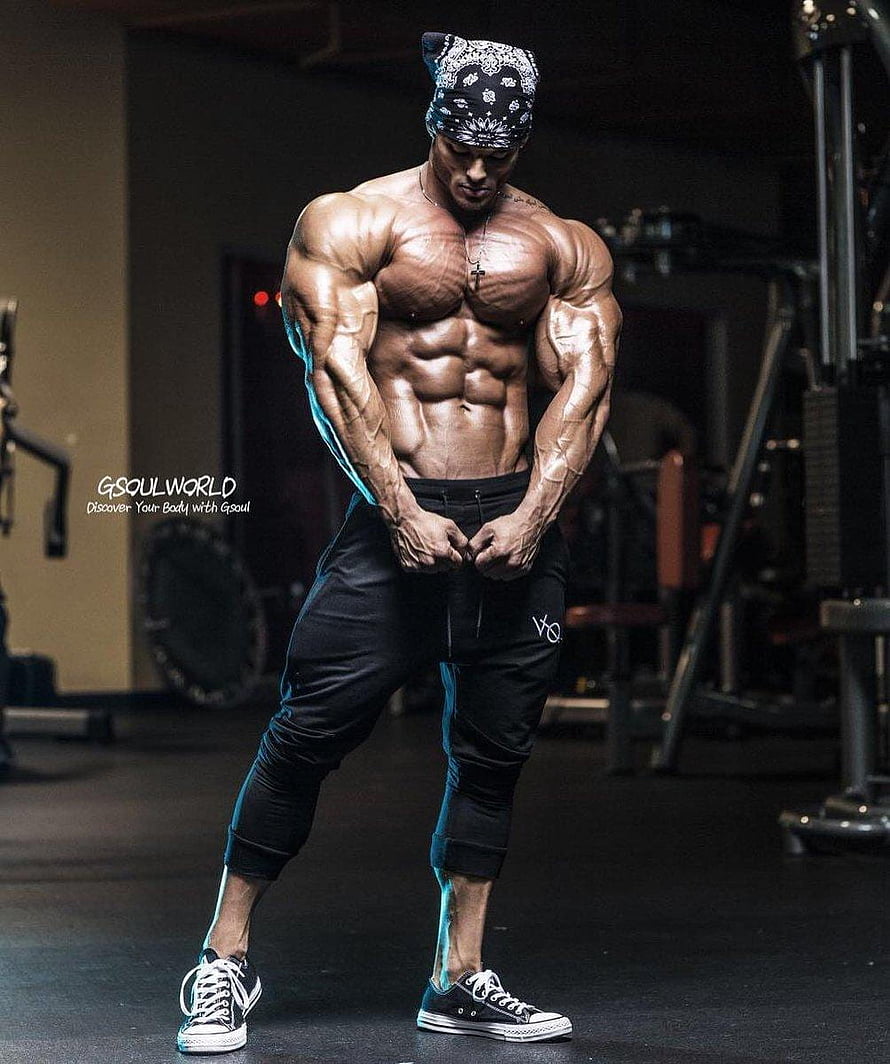 Jeremy Buendia posing shirtless in a dark gym wearing a bandana and black joggers HD phone wallpaper