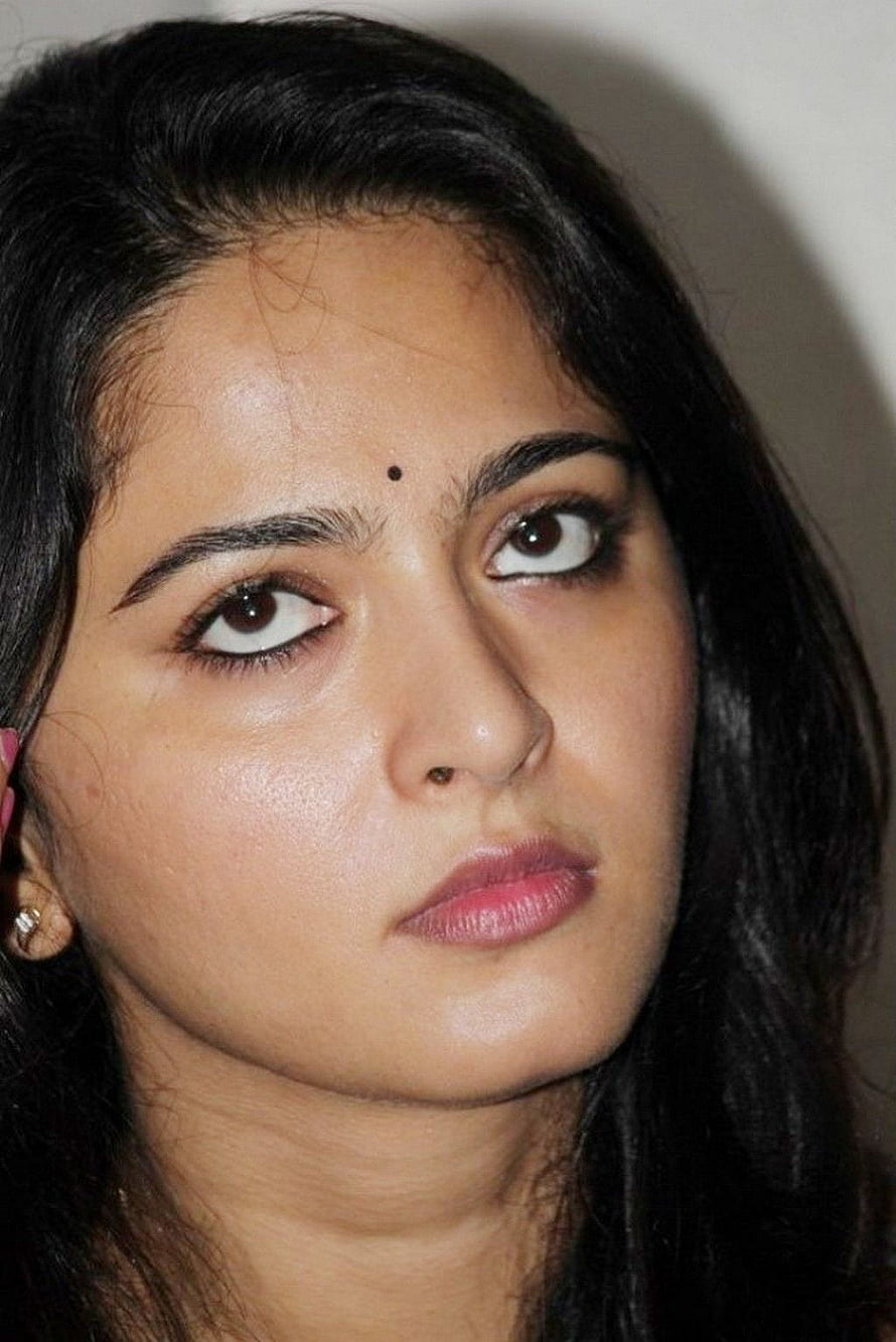 Anushka Shetty Close-Up Portrait with Dark Hair and Expressive Eyes HD phone wallpaper