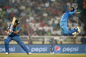 Dynamic Cricket Action Shot Featuring Wicketkeeper Diving for Stumpings HD wallpaper