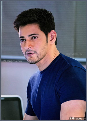 Mahesh Babu in a navy blue t-shirt with a serious expression and short dark hair HD phone wallpaper
