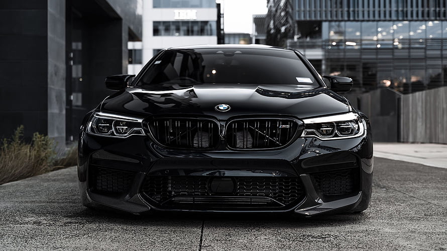 Black BMW M5 F90 Front View Parked in Urban Setting HD wallpaper