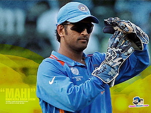 MS Dhoni in Indian Cricket Team Jersey Wearing Wicketkeeping Gloves and Cap HD wallpaper