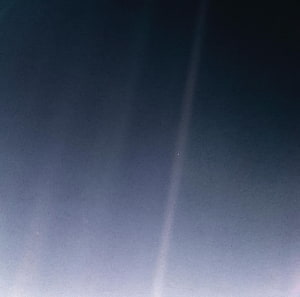 Pale Blue Dot Earth Photograph Against Deep Space Darkness HD wallpaper