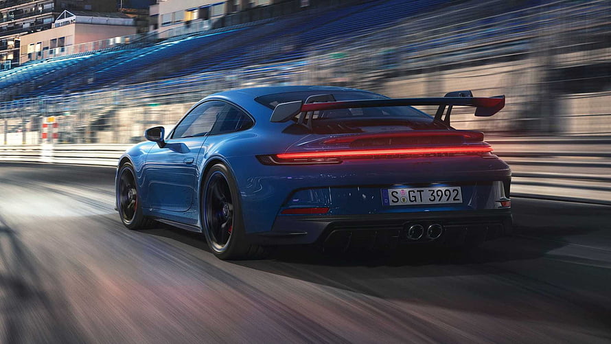 Blue Porsche 911 GT3 Rear View On Track With Large Rear Wing And Motion Blur HD wallpaper