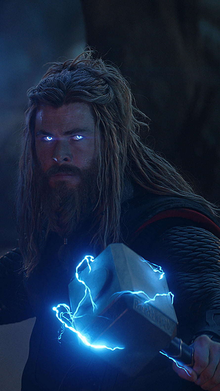 Thor from Avengers Endgame holding Mjolnir with glowing blue lightning and intense eyes HD phone wallpaper