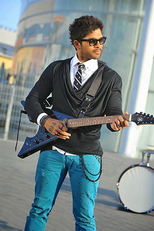 Allu Arjun Playing Electric Guitar in Stylish Black and Turquoise Outfit HD phone wallpaper