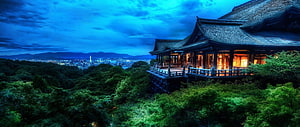 Traditional Japanese Pavilion Overlooking a City at Dusk HD wallpaper