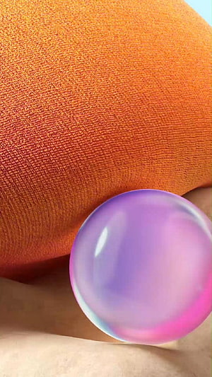 Abstract 3D Render of a Glossy Purple Sphere on Textured Orange Fabric HD phone wallpaper
