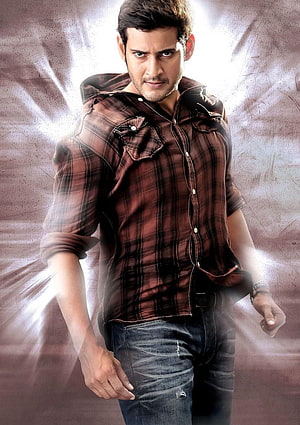 Mahesh Babu in a plaid shirt and jeans with a dramatic light burst background HD phone wallpaper