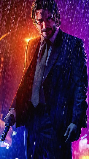 John Wick in a dark suit holding a gun in the rain with neon lights HD phone wallpaper
