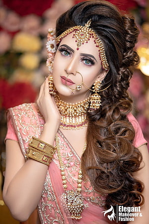 Elegant Indian Bride in Pink Saree with Traditional Gold Jewelry and Floral Hair HD phone wallpaper