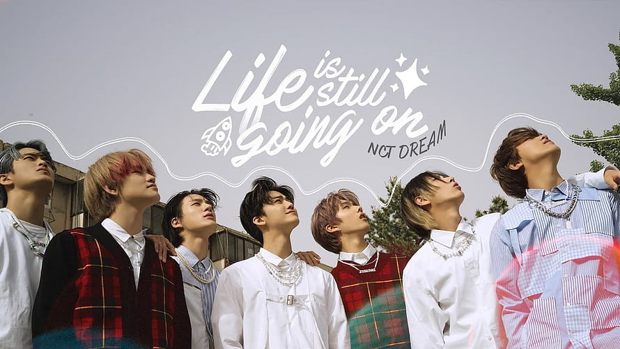 NCT DREAM Life Is Still Going On promotional photo with handwritten text and outdoor group portrait HD wallpaper