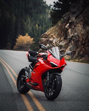 Red Ducati Panigale V4 Sportbike Parked on Mountain Road HD phone wallpaper