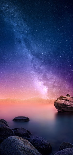 Milky Way Galaxy Over Serene Lake With Rocky Shoreline At Night HD phone wallpaper