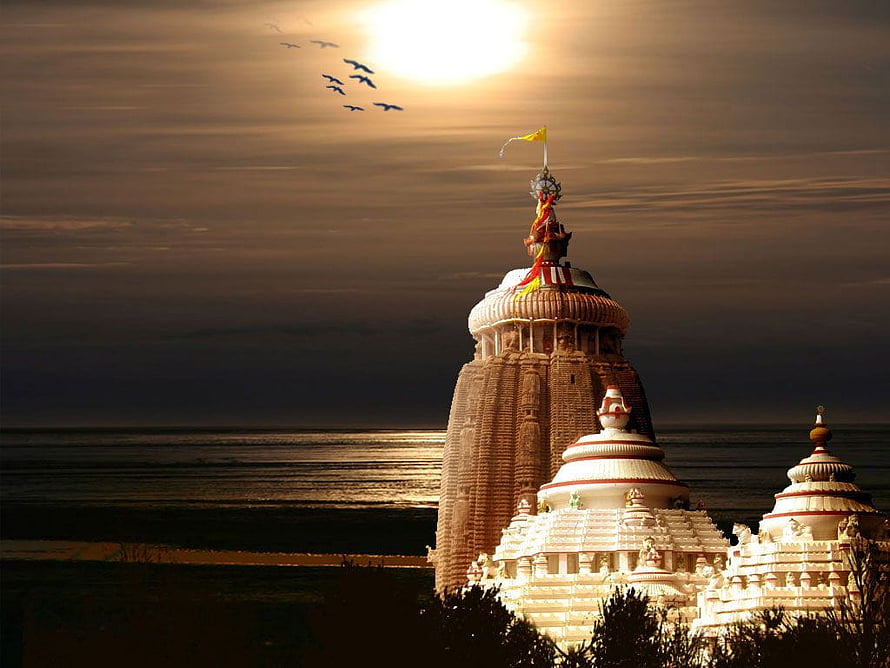Jagannath Temple Puri at Golden Hour with Birds Flying Over the Sea HD wallpaper