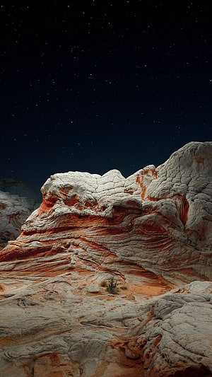 Striking Red and White Sandstone Rock Formation Under a Starry Night Sky HD phone wallpaper