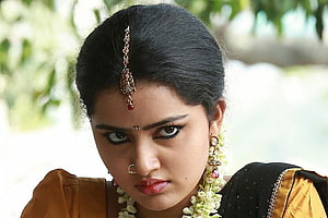 Anupama Parameswaran in Traditional Attire with Floral Garland and Jewelry HD wallpaper