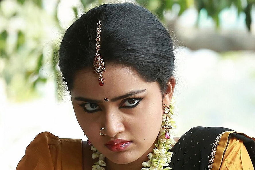 Anupama Parameswaran in Traditional Attire with Floral Garland and Jewelry HD wallpaper