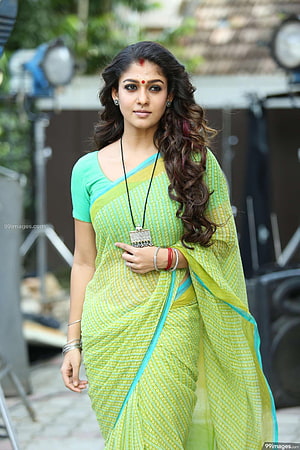 Nayanthara in a Vibrant Green Saree with Traditional Jewelry and Wavy Hair HD phone wallpaper