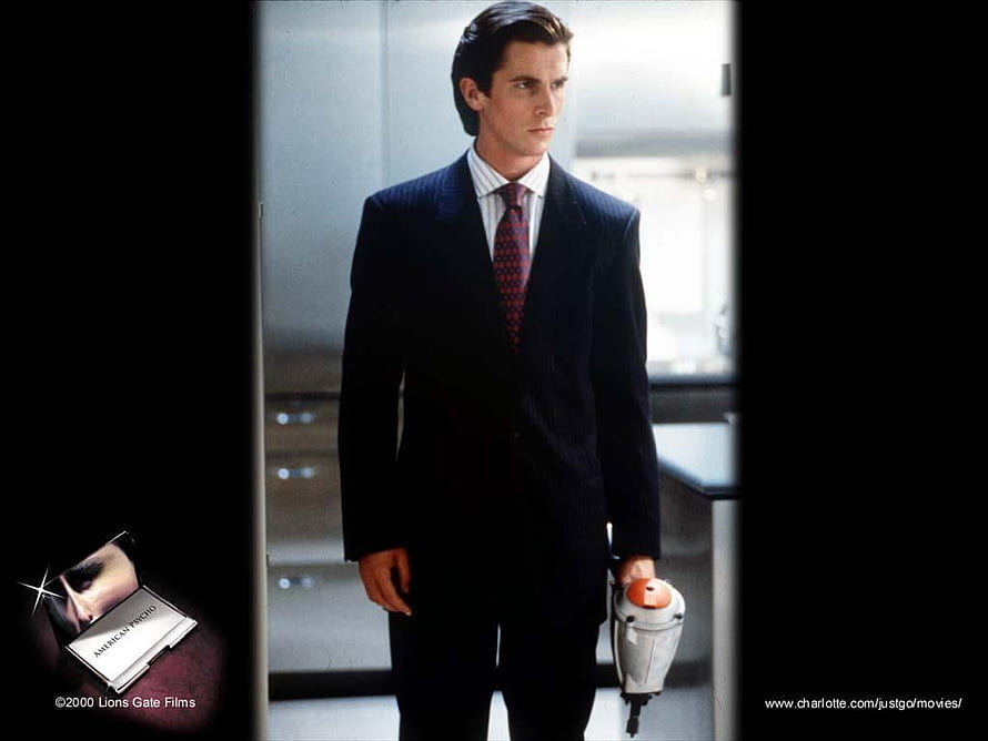 Patrick Bateman in a dark suit holding a weapon in the American Psycho film scene, American Psycho patrick bateman, #patrick bateman HD wallpaper