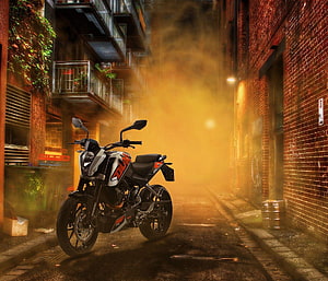 KTM Duke motorcycle parked in a narrow foggy alley with warm orange lighting HD wallpaper