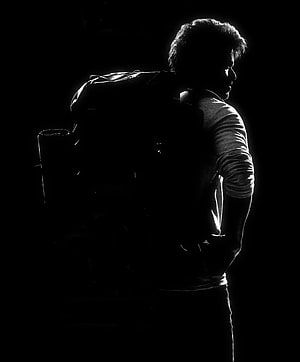 Silhouette of a Man with a Backpack in Dramatic Black and White Lighting, Thalapathy 66 Vijay Varisu Movie First Look Poster, #varisu HD phone wallpaper