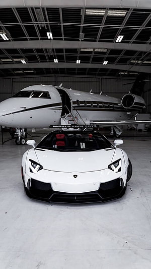 White Lamborghini Aventador SVJ Parked in Hangar with Private Jet HD phone wallpaper