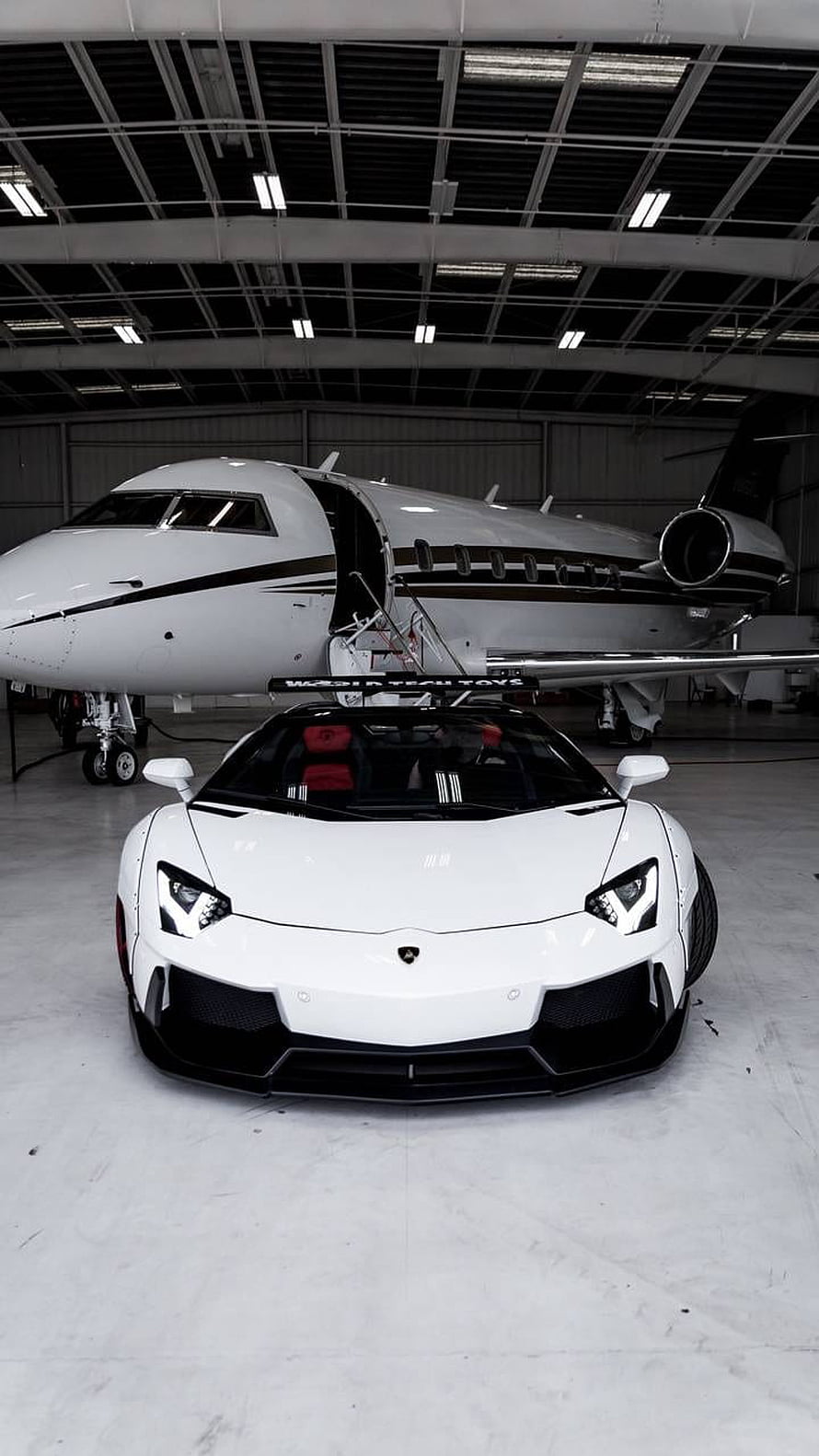 White Lamborghini Aventador SVJ Parked in Hangar with Private Jet HD phone wallpaper