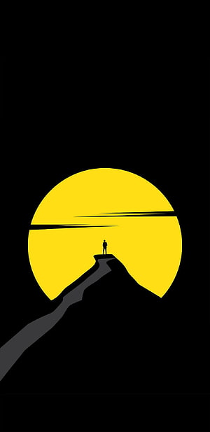 Minimalist Silhouette of a Person Standing on a Cliff Against a Giant Yellow Sun HD phone wallpaper
